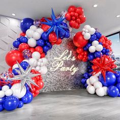 an entrance decorated with red, white and blue balloons