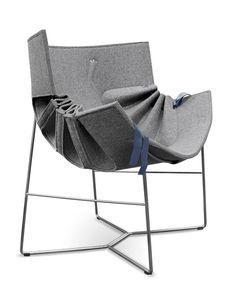 a gray chair sitting on top of a metal frame