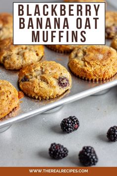 blackberry banana oat muffins on a baking sheet with fresh blackberries in the background