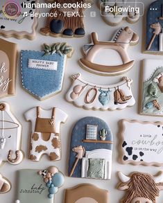 decorated cookies are arranged in the shape of animals and other items for baby's first birthday