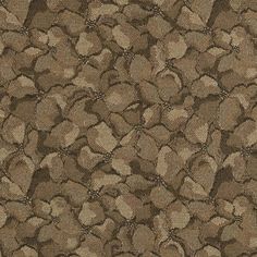 an upholstered brown and beige background with small circles