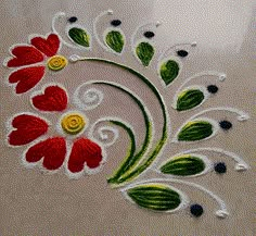 an artistically designed piece of cloth with flowers and leaves painted on the surface in white, green, red and yellow colors