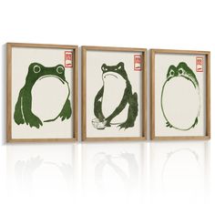 three framed art pieces with green and white designs on them, one frog the other toad