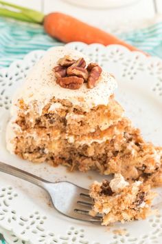 a piece of carrot cake on a plate with a fork