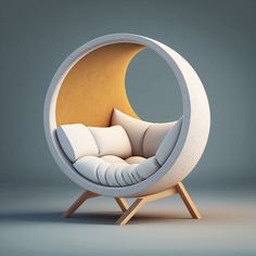 a white chair with pillows in the shape of a moon