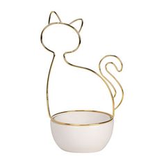 a white bowl with a gold metal cat on it