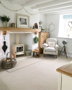 a living room filled with furniture and a fire place