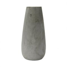 a gray vase sitting on top of a white table