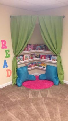 a child's bedroom with green drapes and pink rugs on the floor