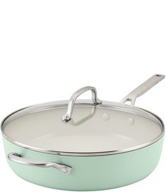 a green pan with a handle on it