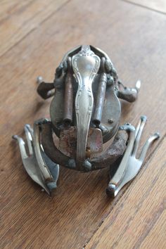 a metal object sitting on top of a wooden floor