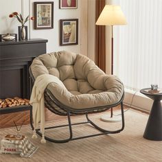 a living room with a rocking chair and pictures on the wall