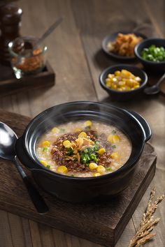 a bowl of soup on a wooden table