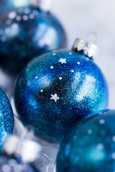 blue christmas ornaments with white stars on them