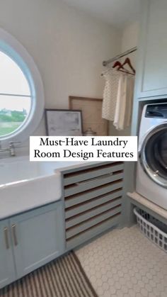 a bathroom with a round window and lots of cabinets in the corner that has a rug on the floor