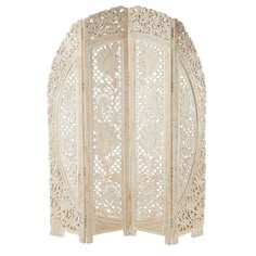 an intricately carved white screen with flowers and leaves on the sides, set against a white background