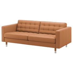 a tan leather couch with chrome legs