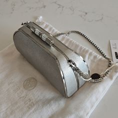 Versace Silver Clutch Bag Nwt Estimate Measurements 7"4" High-end Pouch Evening Bag With Dust Bag, Designer Evening Clutch With Silver-tone Hardware, Luxury Silver Box Shoulder Bag, Luxury Silver Box Bag, Luxury Silver-tone Pouch Evening Bag, Luxury Handheld Evening Bag With Removable Pouch, Luxury Crossbody Clutch With Silver-tone Hardware, Luxury Clutch With Silver-tone Hardware, Luxury Pouch Clutch With Silver-tone Hardware