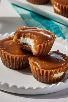 three peanut butter cups sitting on top of a white plate