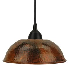 an old fashioned copper colored metal light fixture with a black cord hanging from the ceiling