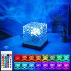 an ice cube lamp with remote controls and color changing lights in front of the box