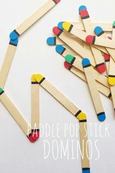 popsicle stick dominos are arranged on top of each other in different colors and shapes