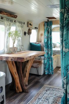 the interior of a mobile home with a table and couches in front of it