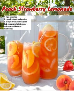 peach strawberry lemonade in pitchers with strawberries