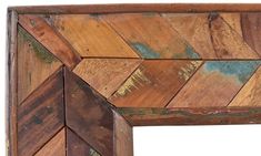 an old wooden frame with many different colored wood pieces on the edges and bottom half