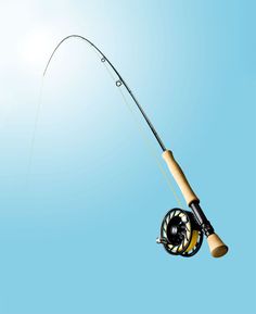 a fishing rod and reel in the air