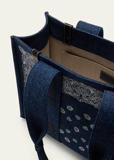 "Find CHLOÉ X High Summer Woody Medium Tote Bag In Bandana Embroidered on Editorialist. Chloe \"Woody\" tote bag in bandana embroidered denim cotton and leather Branded shoulder straps Open top Interior, one slip pocket Approx. 10.2\"H x 14.6\"W x 4.7\"D Made in Italy" Luxury Blue Denim Bag, Luxury Denim Shoulder Bag With Double Handle, Designer Denim Shoulder Bag With Branded Hardware, Luxury Denim Tote Shoulder Bag, On-the-go Denim Bags With Leather Handles, Summer Tote Bags, Travel Size Perfume, Embroidered Tote Bag, Embroidered Tote