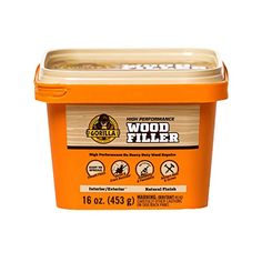 a container of wood filler on a white background