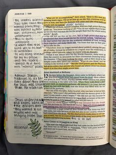 an open bible with colorful text on it