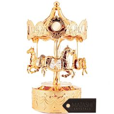 a golden carousel with horses on it