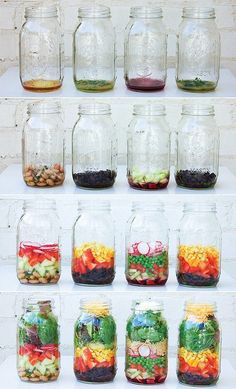 many jars filled with different types of vegetables and fruits in them on top of a shelf