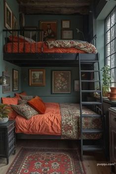 a bedroom with bunk beds and pictures on the wall