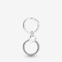 Elevate your keys with the Pandora Moments Charm Key Ring. This sterling silver key ring includes a charm holder with Pandora's iconic snake chain pattern that can hold a maximum of three charms. The key ring also features a small dangling tag with the Pandora logo. Brighten your day with a key ring made to hold your favourite charms that show off who you are and personalise your style. Available in-store and online. | Pandora Moments Charm Key Ring in Sterling silver Pandora Logo, Pandora Jewelry Charms, Charms Pandora, Bracelet Pandora, Charm Holder, Silver Key, Chain Pattern, Pandora Style, Wedding Accessories Jewelry