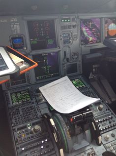 the cockpit of an airplane with many instruments