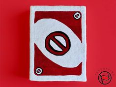 a red and white towel with a no entry sign on it