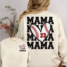 the back of a woman's sweatshirt with a baseball heart and number 22 printed on it