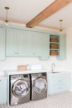 the laundry room is clean and ready to be used as a washer and dryer