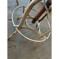 an old bicycle is sitting on the ground