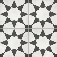 a black and white tile pattern that looks like hexagonals or stars on the floor