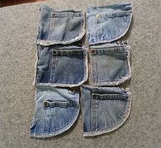 several pieces of blue jean sitting on top of a table