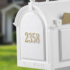 a white mailbox with the number 2238 on it's front and side