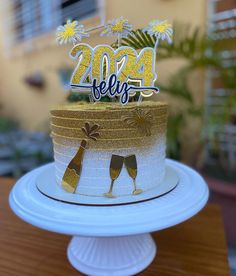 a cake with two champagne glasses on it