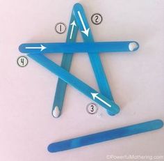 an image of a star made out of toothbrushes and plastic straws with arrows pointing to it