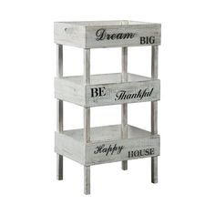 three tiered wooden shelves with words on the bottom, one saying be happy house