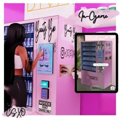 a woman standing in front of a pink vending machine next to a cell phone