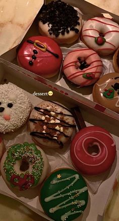 two boxes filled with different kinds of donuts